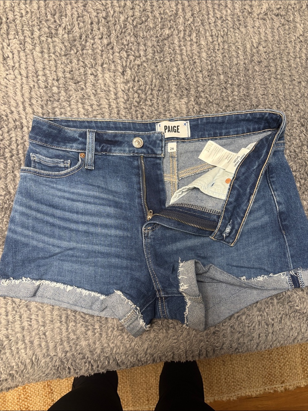 PAIGE blue denim cutoff shorts with frayed hem